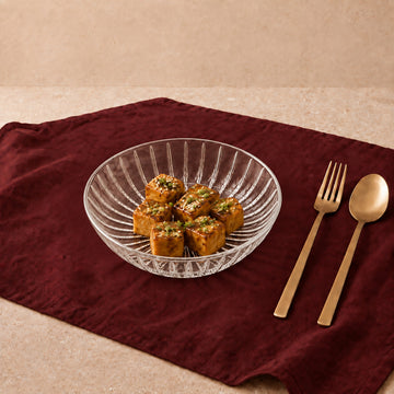 Serve evening bites, starters, and tea-time snacks with Dabeli Clear Snack Plates. Measuring 13cm across with a versatile 230ml volume, each plate features a subtle raised rim and crystal-clear finish designed to present finger foods, desserts, and appetizers with effortless style.