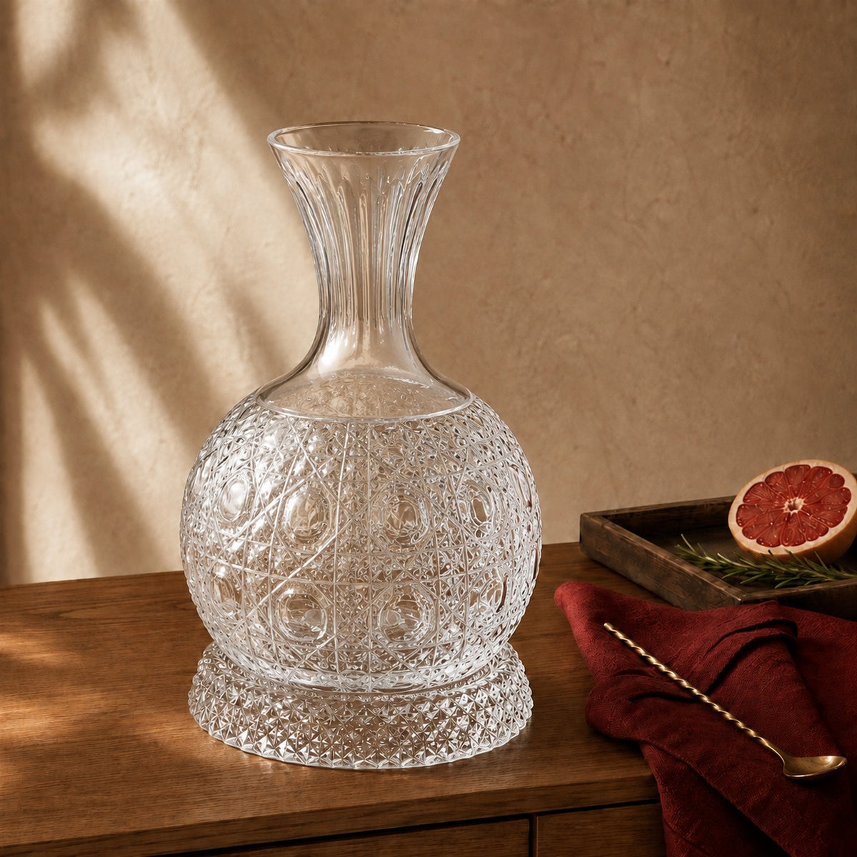 Elevate your home bar with this 360° Spinning Crystal Decanter. Built with a precision-balanced curved bottom and a matching diamond-faceted pedestal base, this decanter glides into a smooth rotation with a light nudge, naturally aerating your favourite spirits while reflecting ambient light through deep crystal facets.